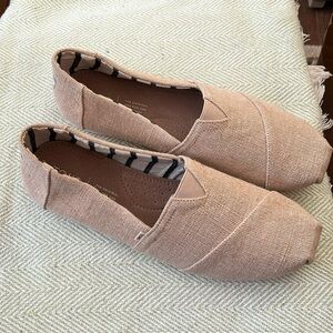 Men’s size 12 canvas slip on by Toms. Color is unbleached canvas.